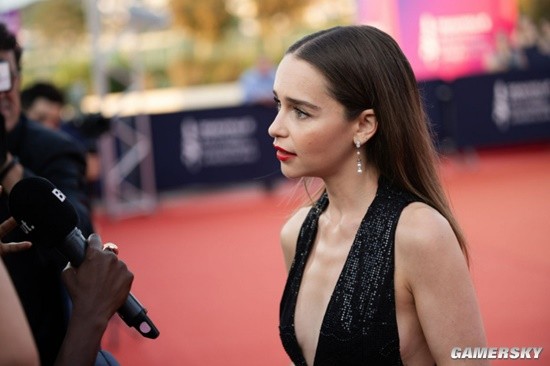 "Emilia Clarke Shines at Film Festival in a Stunning Deep V Gown"
