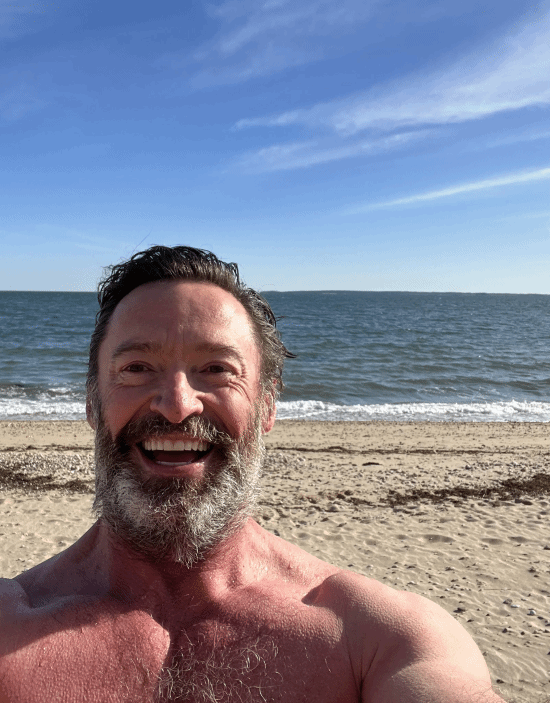 "Uncle Wolf" Hugh Jackman shared a recent photo: Laughing alone at the beach
